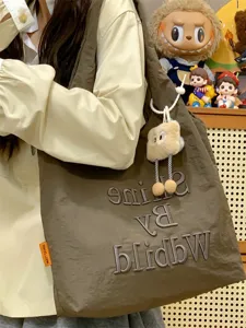 Casual canvas tote bag for women, stylish embroidered shoulder bag with cute plush charm.