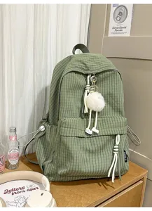 Korean style green corduroy casual backpack for women, cute school bag with pom-pom pendant.
