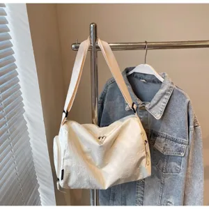 White casual travel shoulder bag detail view, large capacity canvas messenger bag for daily use.
