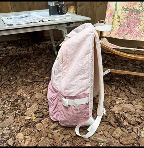 Casual pink lightweight backpack for women, ideal for outdoor travel, school and daily use.