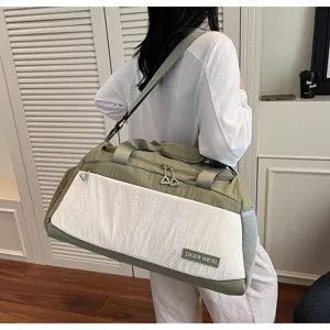 Large capacity travel duffel bag for women, lightweight sports gym bag with shoulder strap.
