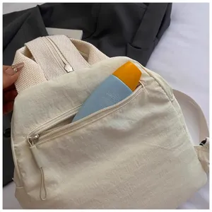 Korean minimalist casual canvas backpack for women, stylish daily travel chest bag with zip pocket.
