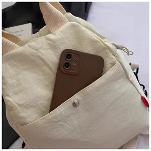 Minimalist canvas crossbody bag for women, casual daily shoulder bag with front pocket.