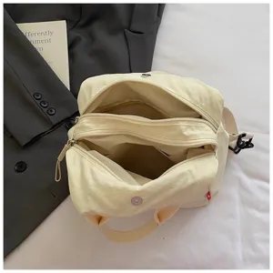 Casual canvas shoulder bag for women, multi-compartment crossbody bag for daily travel.