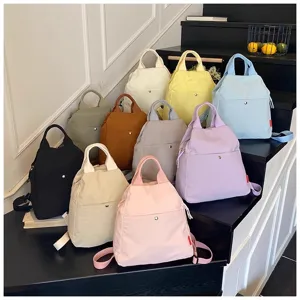Women casual canvas backpack stylish multi-color travel school daypack with top handle.