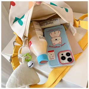 Canvas shoulder bag detail showing interior storage capacity, cute design with yellow straps.