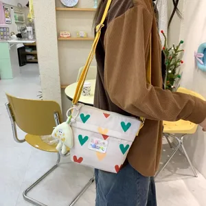 Cute canvas crossbody bag for women, summer new student daily storage bucket shoulder bag.