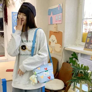 Cute canvas crossbody bag for women, daily casual shoulder bag with colorful heart print.