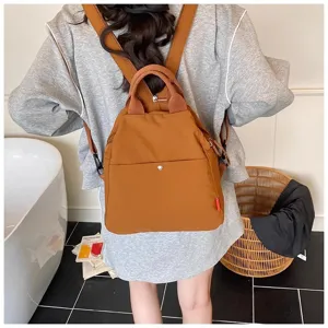 Brown casual backpack detail view showing the stylish design and durable canvas material.