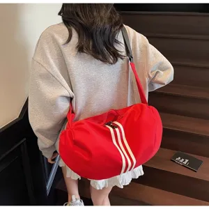 Large capacity red sports gym bag with stylish three stripes design for outdoor travel.