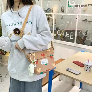 Cute canvas crossbody bag with heart print, lightweight shoulder bag for daily casual style.