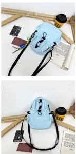 Detailed view of the light blue casual sling bag showing strap, drawstring and fabric texture.