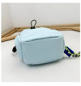 Light blue mini casual crossbody bag detail showing compact design and drawstring.