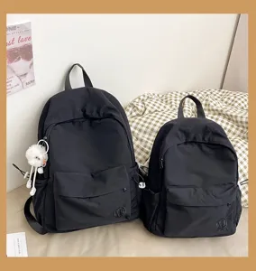 Casual solid color nylon backpack set, versatile school bag for students and travel.