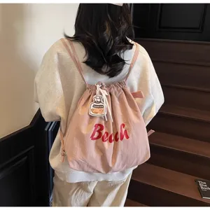 Sac a dos decontracte en nylon rose pour femme, style plage sac de tous les jours.