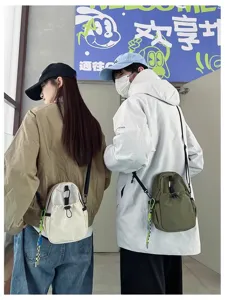 Casual nylon crossbody bag for men and women, lightweight daily messenger and phone shoulder bag.