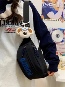 Trendy black chest bag with plush dog keychain, stylish Japanese style crossbody bag for daily.
