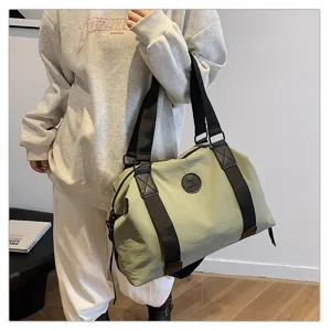 Large capacity travel duffel bag for men and women waterproof weekender gym shoulder bag with straps.