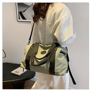 Spacious travel duffel bag with shoulder strap, perfect for short trips and gym use.