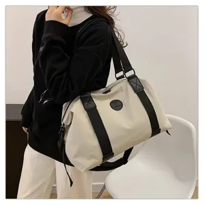 Large capacity travel duffel bag with shoulder strap, ideal for short trips and fitness.
