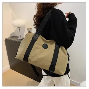 Large capacity canvas travel duffel bag shoulder bag for casual short trips and fitness.