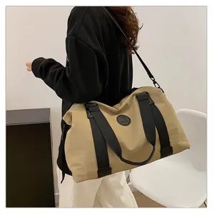 Large capacity travel duffel bag waterproof gym shoulder bag for men and women trips.