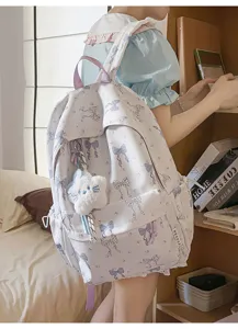 Cute Japanese style bow print school backpack for teenage girls, large capacity travel bag.