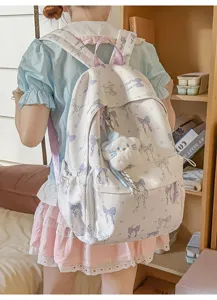 Japanese style cute blue bow print backpack for girls, large capacity casual school travel bag.