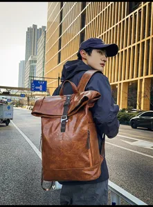Stylish vintage brown leather rolltop backpack for men casual travel school use.