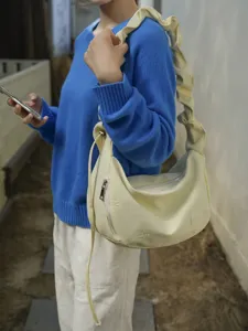 Casual shoulder bag for women, stylish ruffled strap cloud bag with chic embroidery details.
