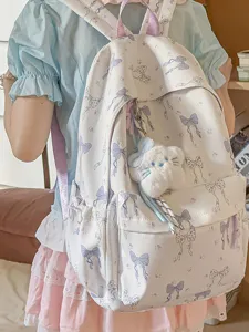 Japanese sweet style school backpack with blue bow print, large capacity aesthetic travel bag.