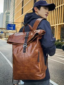 Vintage brown PU leather roll-top backpack for men and women, stylish casual travel bag.