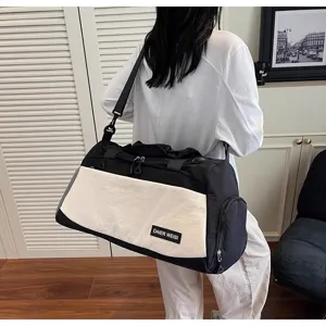 Detail view of the lightweight black and white travel duffel bag, showing spacious compartment.