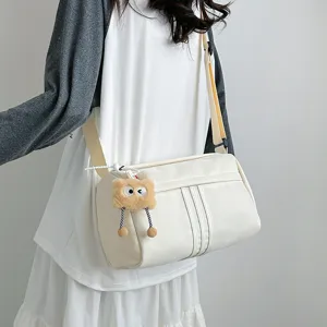 Casual large capacity canvas crossbody bag detail, minimalist cylinder shoulder bag for women.
