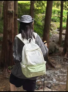 Lightweight outdoor travel backpack for women, large capacity stylish casual daypack.