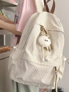 Korean style plaid backpack for women, lightweight casual school bag with cute plush pendant.