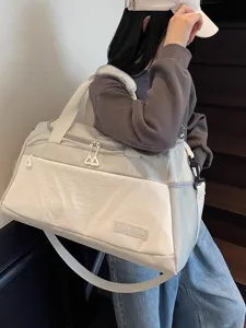 Large capacity travel duffel bag for women, lightweight gym sports bag for short weekend trips.