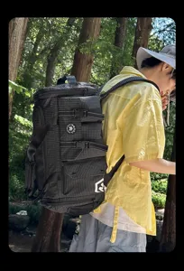 Large capacity waterproof grid travel backpack and sports duffel bag for outdoor use.