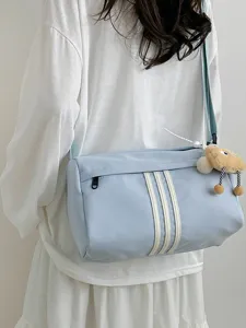 Casual light blue cylindrical crossbody bag with three white stripes for women daily travel.