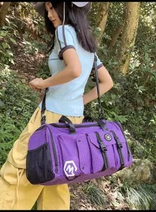 Large capacity purple plaid travel duffel bag with multiple pockets and shoulder strap.