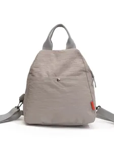 Casual gray nylon backpack for women, minimalist daily travel student shoulder school bag.