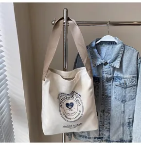Large capacity canvas shoulder bag for women, casual everyday tote with retro print design.