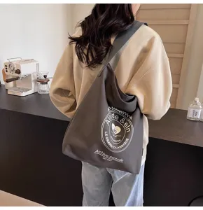 Casual large capacity canvas shoulder bag detail, stylish grey crossbody tote for daily wear.