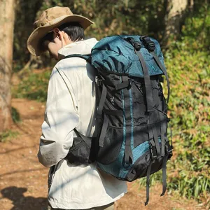 Outdoor mountaineering backpack detail showing multi-functional straps and 55L storage space.
