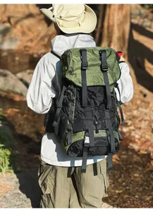 Outdoor functional large capacity hiking backpack in black and green, durable fabric.