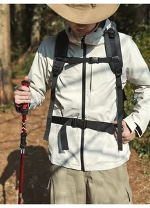Outdoor backpack detail showing durable straps, buckle system and ergonomic design for hiking.