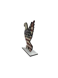 Wooden bald eagle ornament detail showing American flag pattern and sturdy white display base.