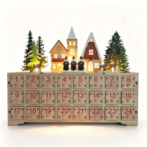 Wooden Christmas advent calendar detail featuring glowing German village scene and numbered drawers.