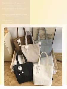 Casual canvas tote bag for women, retro large capacity shoulder bag for daily commuting and school.