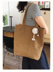 Simple retro large capacity casual canvas tote bag for women commuting and daily school use.